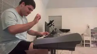 Nicolás playing the keyboard with 2 hands