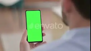 Young Man Holding Chroma Screen Smartphone | Stock Footage - Envato elements