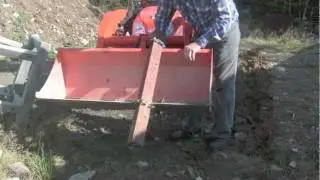 Homemade trencher for tractor bucket on Kubota BX