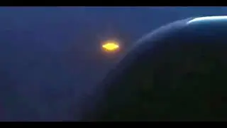 Golden UFO caught on video by plane passenger, plus other amazing sightings