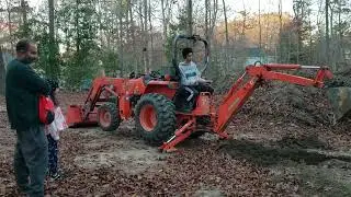 how much is this Rock worth? & friends stop by and test the backhoe.
