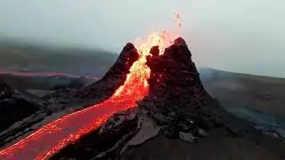 lava fields and an erupting volcano in Iceland 😮😮
