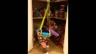Baby Jane laughing in her door jumper