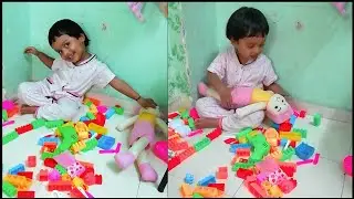 Anam Playing with toys