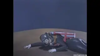 A Japanese Frogwoman in a rubber wetsuit ...and a rubber monster