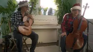 Guy plays cello and guitar LIVE