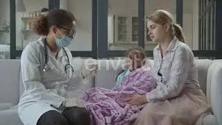 Female Doctor Measuring Temperature of Iil Girl | Stock Footage - Envato elements