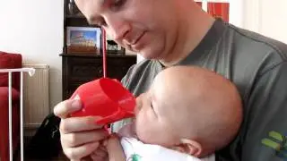 Cup feeding a 4mo baby with expressed breast milk