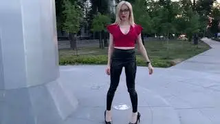Walking in leather leggings and patent high heels.