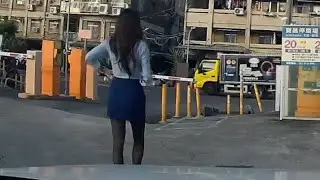 The girl in black stockings is being chased by a chicken