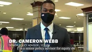 Dr. Cameron Webb speaks at the Norfolk Community Vaccination Center