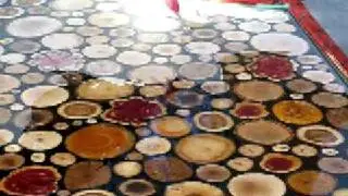 Spreading the epoxy over sanded wooden disks