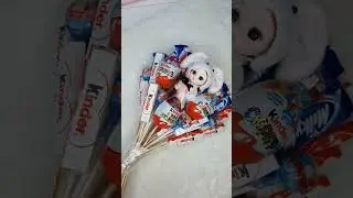 Букет из конфет с подсветкой и куколкой.