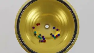 Mesmerizing Marble Beats: A Gravity Symphony in the Funnel