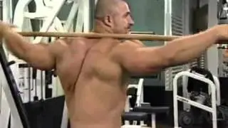 Вращение с палкой на плечах