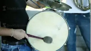 Drummer in a Marching Band. Drummer plays big drum
