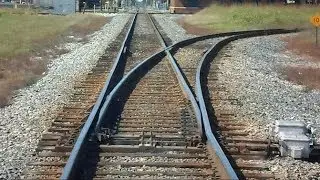 Amtrak Train Passes Track Switches CSX Train Passes