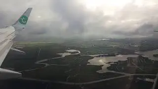 Transavia Boeing landing in Amsterdam with wing vortex