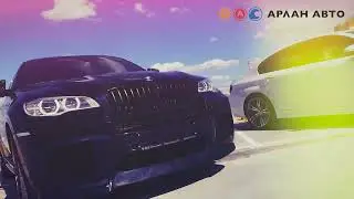 BMW X5 на крыше Паркинга Автосалона 