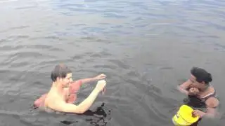Feeding the dolphins in the Amazon River