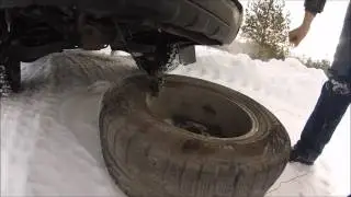 How to remove the spare tire on a Nissan Pathfinder