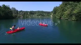 Four young friends paddling canoe and splashing each other with water | Stock Footage - Envato e...