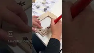 Laboratorio di pirografia su una cornice di legno.