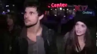 Taylor Lautner attends Jay Z concert with Marie Avgeropoulos