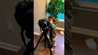 2-year-old photographer loves the camera