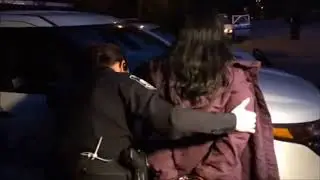What is this woman being arrested for?