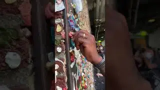 STICKING GUM TO THE FAMOUS GUM WALL IN SEATTLE 