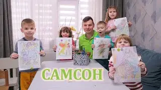 Папа с детьми читает историю, раскрашивает и проводит время с пользой