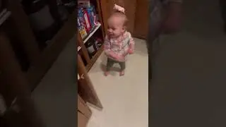Adorable moment of a toddler having conversation about food.