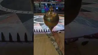 Watching a wooden pin and the Foucault Pendulum collide at the Houston Museum of Natural Science