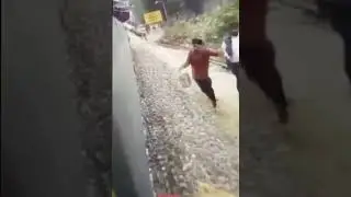 Rural Indian's run after a moving train filled with starving migrants to give them food. Viral video
