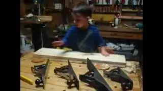 Child identifying wood planes