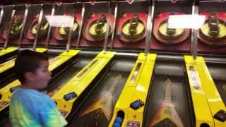 Skee ball and Mario kart at chuck e cheese, family fun time today