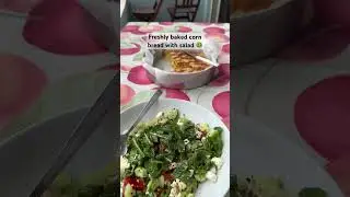 Freshly baked cornbread and salad with cucumber, tomatoes, arugula, djathë cheese