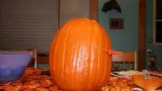 Ghost Carves Halloween Pumpkin