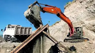 Hitachi Excavator Sorting Rocks, Filtering Sand & Loading Dump Trucks - Rocks Quarry