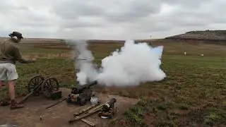 Firing of a replica naval gun.