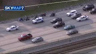 A man is riding a horse on the local lanes of the Dan Ryan Expressway