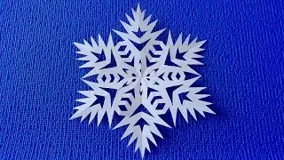 How beautiful it is to cut a paper snowflake.  Paper snowflake tutorial.