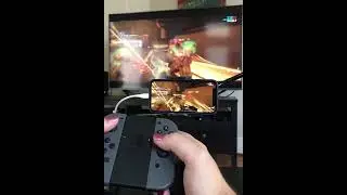 Warframe Mobile beta played using Joycons while also mirrored to my TV.