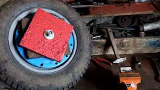 How to quickly and affordably attach wheel weights to a walk-behind tractor.