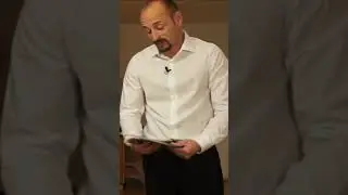 Presenting the wine list to the guests in the restaurant as a waiter