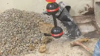 Cutting concrete in a store with the Evolution electric concrete saw.