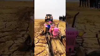 Stucked in a mud #tractor #pink #pinktractor #mud #stuck #stuckinmud #helping #truck #rope #track