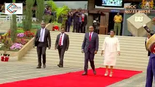 PROF. KINDIKI AND HIS WIFE WALK TO THE VENUE FOR SWEARING IN CEREMONY.