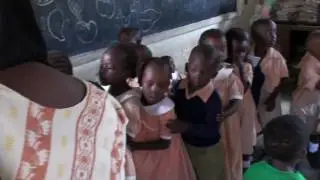 Kenyan school children queuing up for sweets